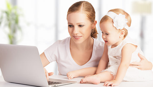 bigstock-Mother-And-Baby-At-Home-Using--61273709