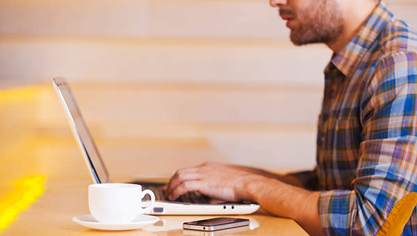 bigstock-Man-Working-In-Coffee-Shop-80811965