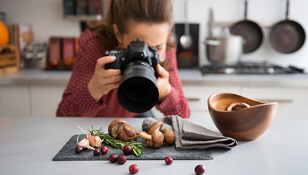 bigstock-Woman-Food-Photographer-Taking-91594508