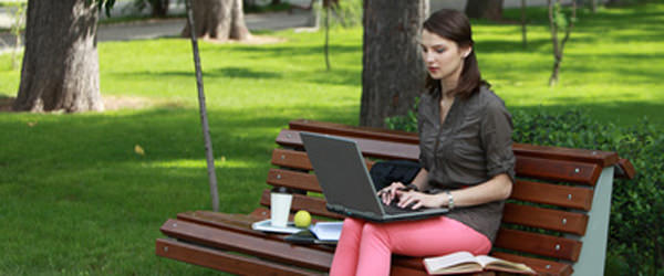 Young Woman Studying in a Park