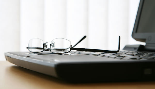 3-Glasses-On-Laptop-Keyboard-42919375