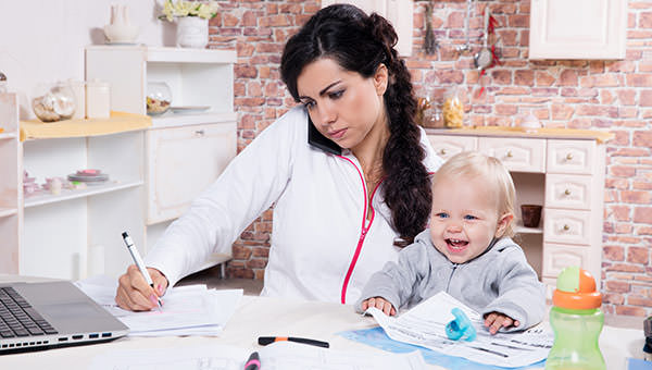 bigstock-Mother-and-baby-in-home-office-52267072