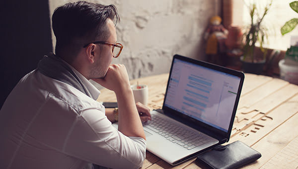 bigstock-Stylish-Man-using-laptop-in-st-95617427