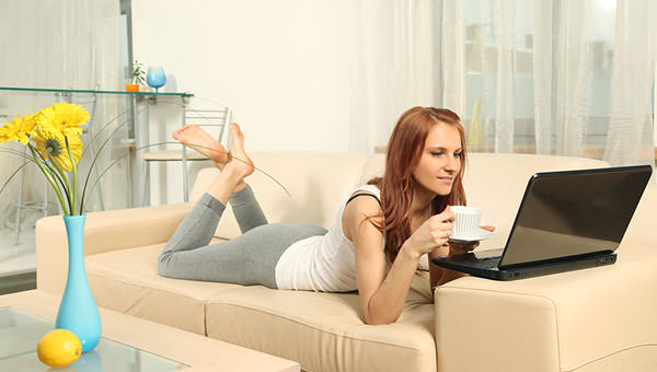 bigstock-cute-young-woman-with-laptop-52228951